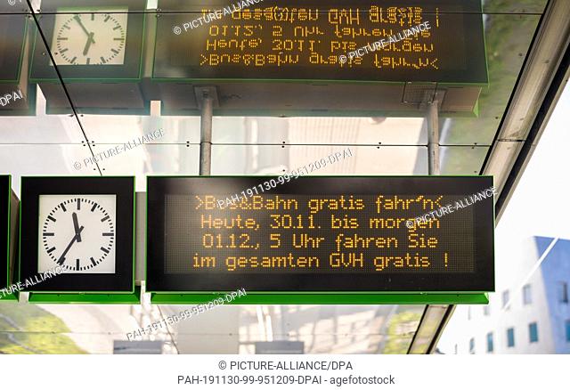 30 November 2019, Lower Saxony, Hanover: A scoreboard at a bus stop indicates that buses and trams can be used free of charge for one day