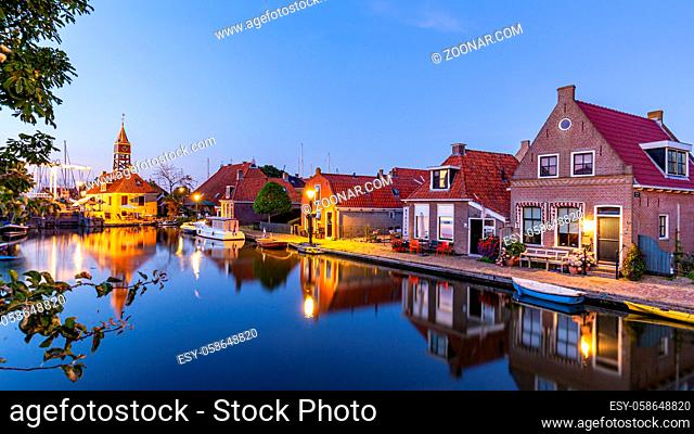 Hindeloopen, Friesland, Netherlands - August 6, 2020: Townscape picturesque fishing village Hindeloopen during the evening in Friesland Netherlands