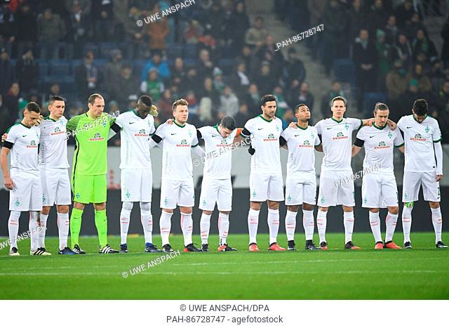 Bremen's players observe a minute of silence in memory of the 19 December attack on a Christmas market in Berli, prior to the German Bundesliga soccer match...