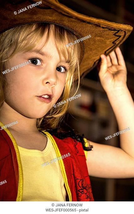 Little girl dressed up as cowboy