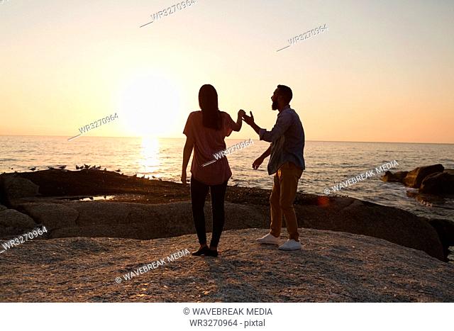 Couple standing near sea side