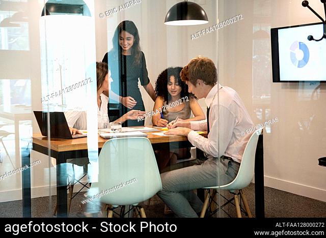 Business people working together in board room