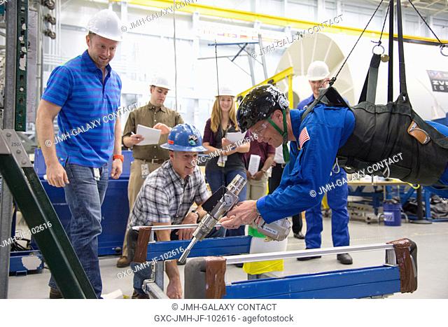 NASA astronaut Reid Wiseman, Expedition 4041 flight engineer, participates in an extravehicular activity (EVA) training session in the Partial Gravity Simulator...