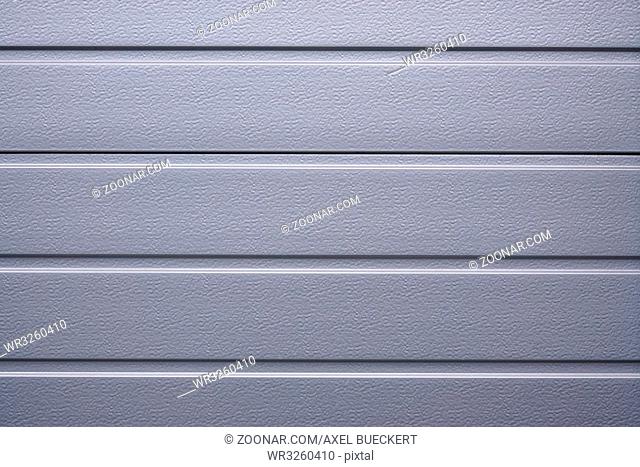 silver gray metallic shutter or cladding. background texture