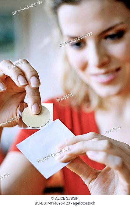 Woman using a nicotine patch