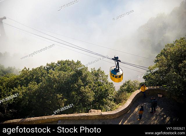 BARCELONA, SPAIN - December 26, 2018: The ropeway of Montserrat in Barcelona, Spain. Montserrat is a Spanish shaped mountain which influenced Antoni Gaudi to...