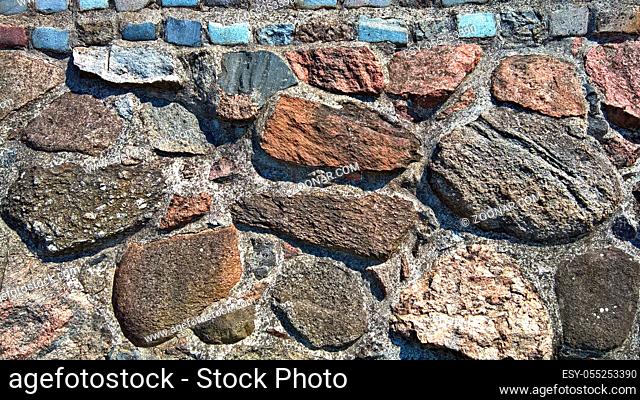 Weathered antique old cracked stone blocks wall retro background