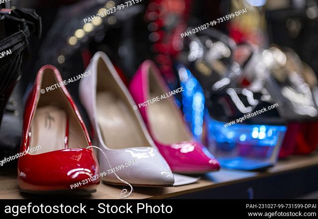 27 October 2023, Berlin: High heels made of patent leather stand at a sales booth at the erotic fair Venus 2023. Photo: Monika Skolimowska/dpa