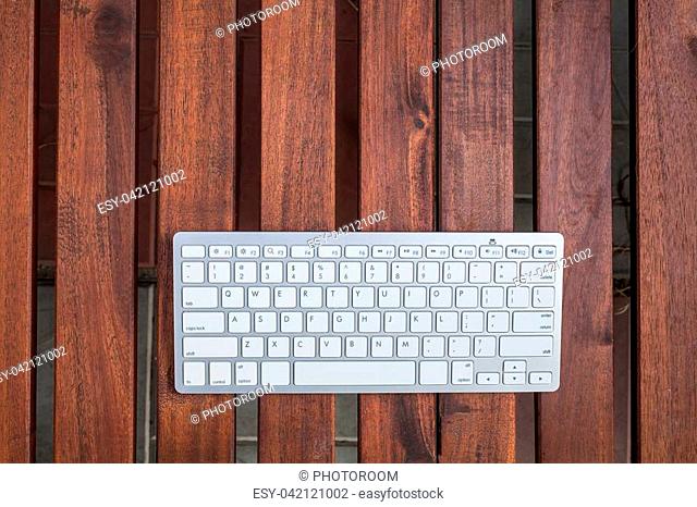 Keyboard on wood plank table