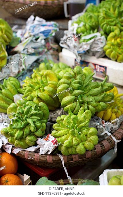 Buddha's fingers citrus fruits at a market in Hanoi, Vietnam