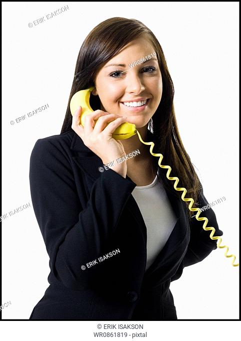 Portrait of a teenage girl talking on the telephone