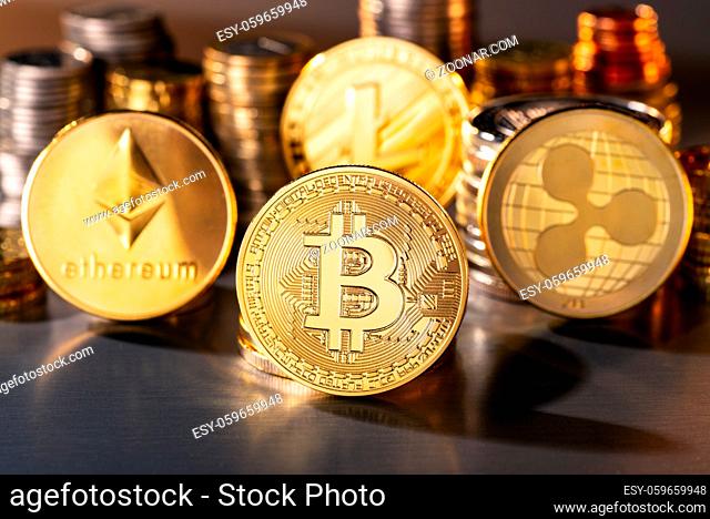 Münzen der vier Kryptowährungen mit der höchsten Marktkapitalisierung