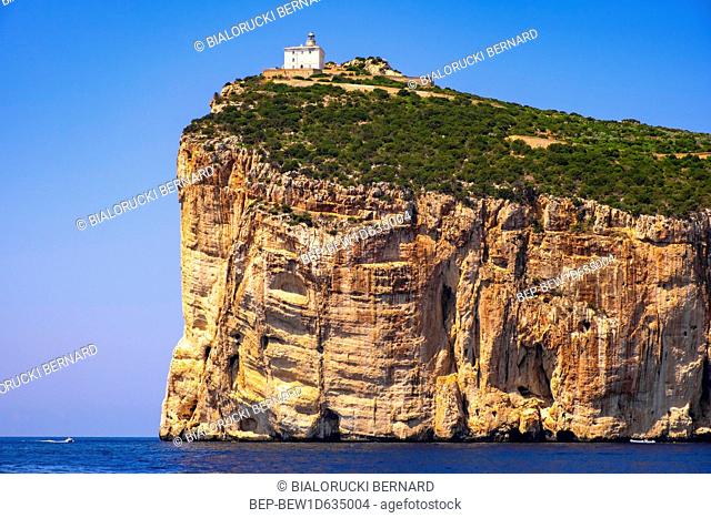Alghero, Sardinia / Italy - 2018/08/09: Faro di Capo Caccia lighthouse at the limestone cliffs of the Capo Caccia cape at the Gulf of Alghero