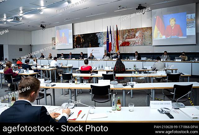 28 June 2021, Berlin: German Chancellor Angela Merkel (CDU) is joining the last meeting of the Franco-German Parliamentary Assembly of this Bundestag election...