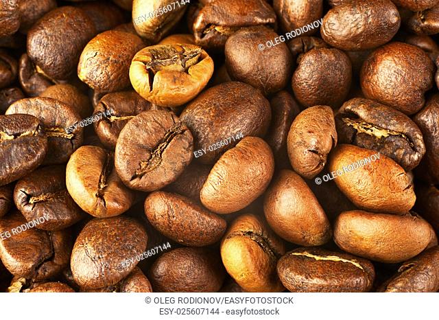 Natural background from roasted coffee beans. Macro shot with tilt effect