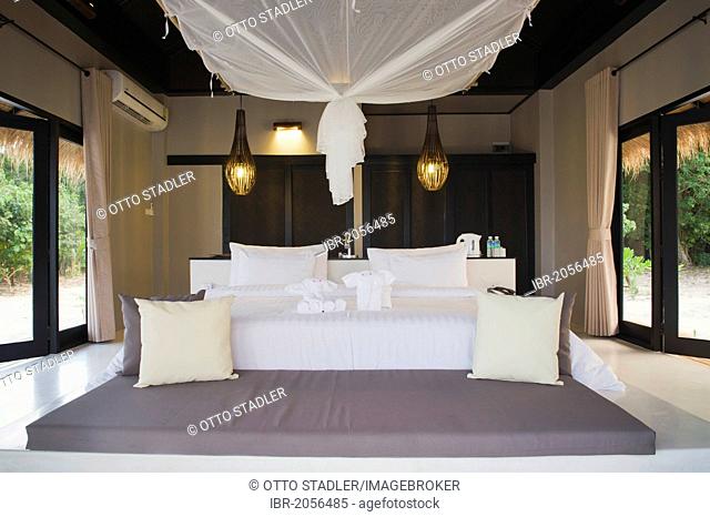 Bed with mosquito net in a luxury bungalow, The Sevenseas Resort, Ko Kradan, Koh Kradan, Trang, Thailand, Southeast Asia, Asia