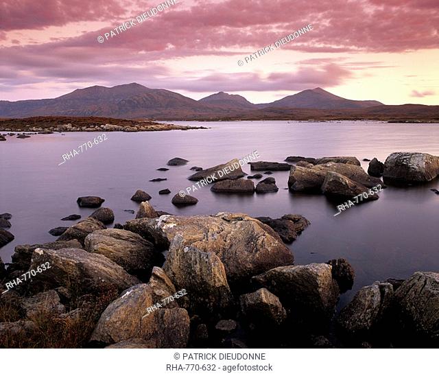 Loch Druidibeg Nature Reserve at sunset, with Hecla, Ben Corodale and Beinn Mhor behind, South Uist, Outer Hebrides, Scotland, United Kingdom, Europe