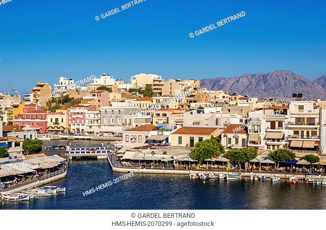 Greece, Crete East, Lassithi District, village of Agios Nikolaos and Lake Voulismeni connected to the sea by a channel
