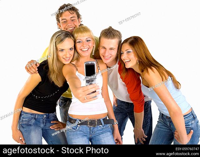 Small group of happy teenagers. Smiling and taking photograph. White background, front view