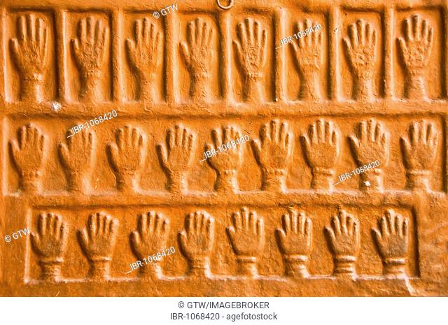 Sati stones, hand imprints of the 15 royal widows of Maharaja Man Singh who committed self-immolation, Mehrangarh Fort, Jodhpur, Rajasthan, India, South Asia