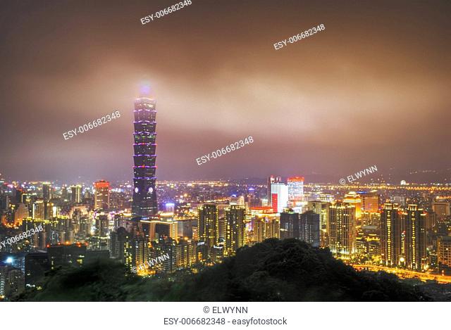 City night scene with clouds over famous skyscraper in Taipei, Taiwan