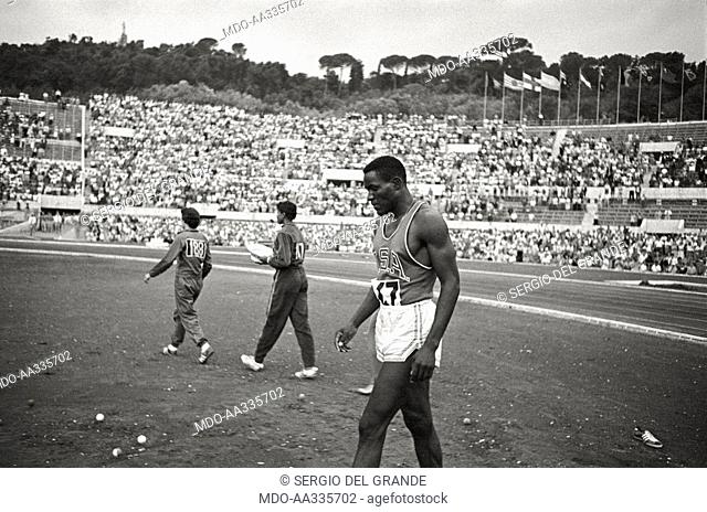 American athlete at the Olympic Games. American athlete walking on the trackside. Rome, 1960