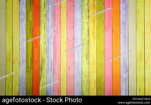 Colorful background image with a pattern of multi-colored vertical stripes with an imitation of a painted wooden surface