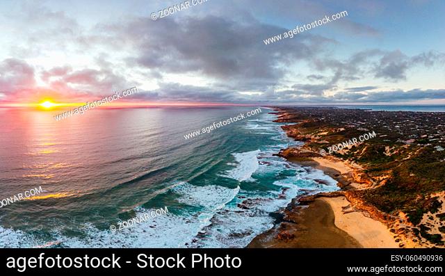 An aerial shot of Mornington Peninsula towards Point Nepean and Port Phillip Bay at sunset in Victoria, Australia