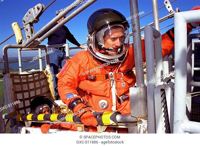 01/10/1998 --- Standing in a slidewire basket at KSC’s Launch Pad 39A is STS-89 Mission Specialist James Reilly, Ph.D. The seven astronauts of STS-89 assigned...