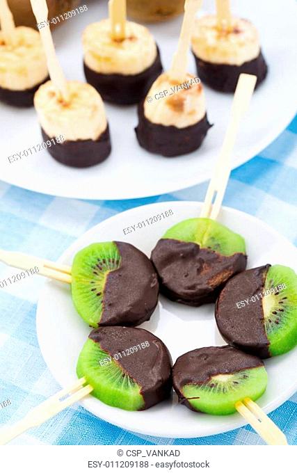 Fruits with chocolate on a stick