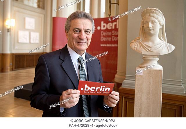 Cherine Chalaby, member of the board of ICANN, poses with a sticker on the occasion of the launch of the domain '.berlin' at the town hall in Berlin, Germany