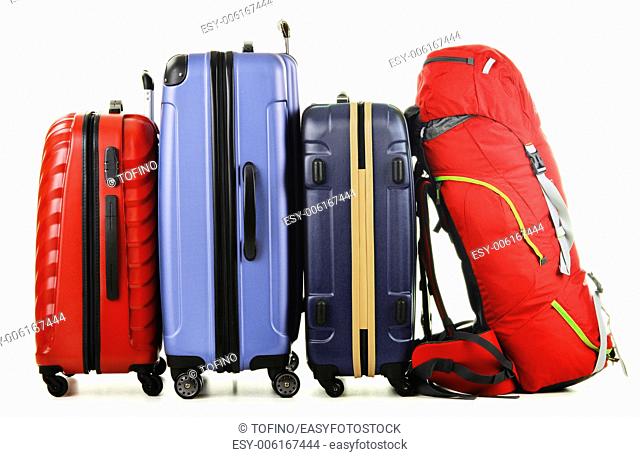 Luggage consisting of large suitcases and rucksack isolated on white