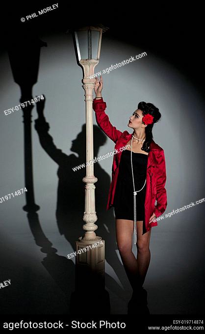 young woman and lightpole