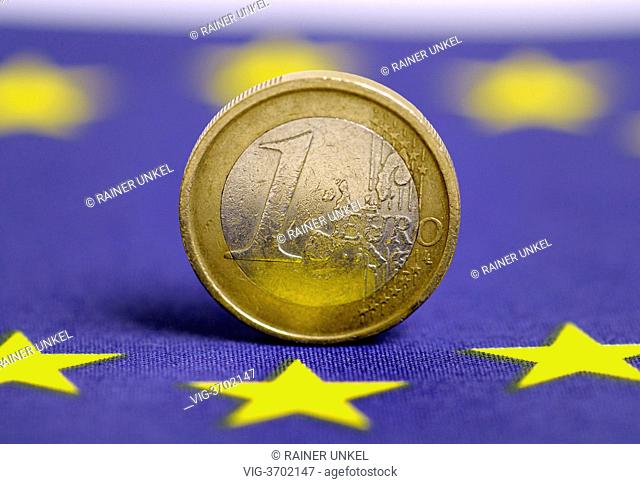 GERMANY, BONN, 20.05.2013, A flag of EU and a one Euro coin - Bonn, Northrhine-, Germany, 20/05/2013
