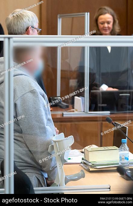 13 January 2021, North Rhine-Westphalia, Hagen: The defendant stands next to his defense attorney Andreas Trode in the district court