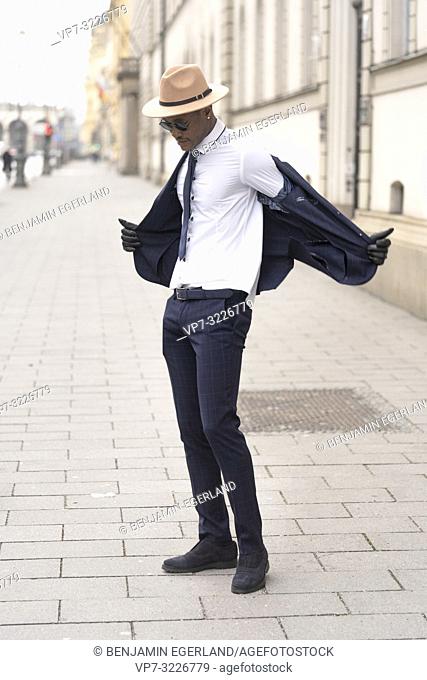 Fashionable man on the street, Munich, Germany