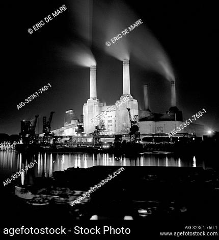 BATTERSEA POWER STATION, London. View from the north bank of the River Thames at night. It was designed by Sir Giles Gilbert Scott in 1937 and was the largest...