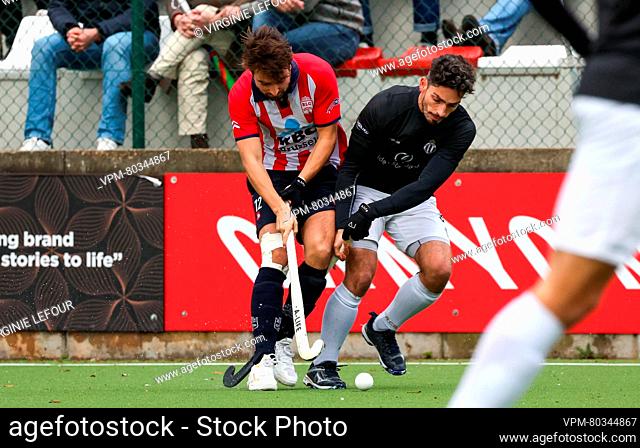 Leopold's Corentin De Trez and Racing's Tanguy Cosyns fight for the ball during a hockey game between Royal Leopold Club and Royal Racing Club Bruxelles