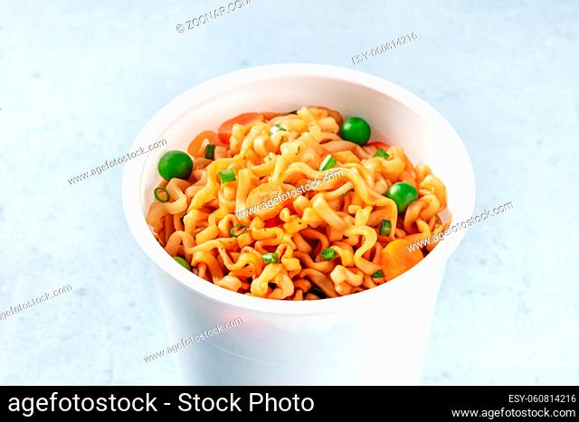 Ramen cup. Instant noodles close-up. Asian vegan fast food lunch