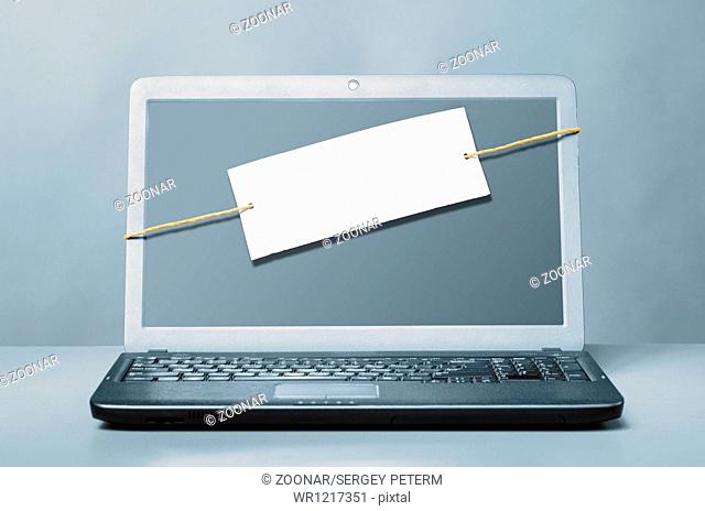 laptop with blank note