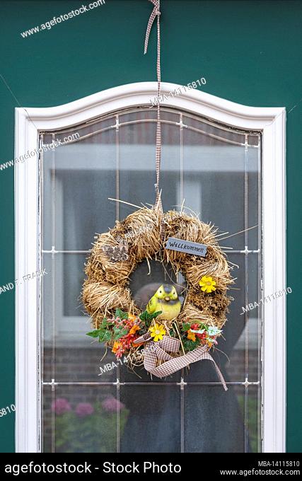 germany, lower saxony, east frisia, ditzum, typical door with floral decorations