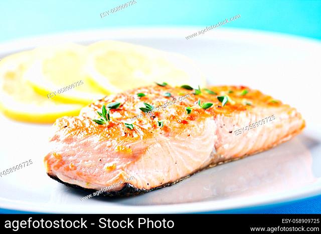 Fillet of salmon with asparagus on a plate