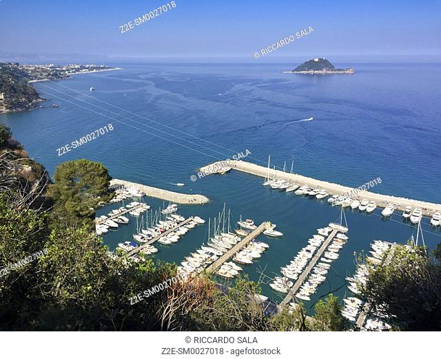 Italy, Liguria, Alassio, Punta Santa Croce, Harbour background Gallinara Island. . .