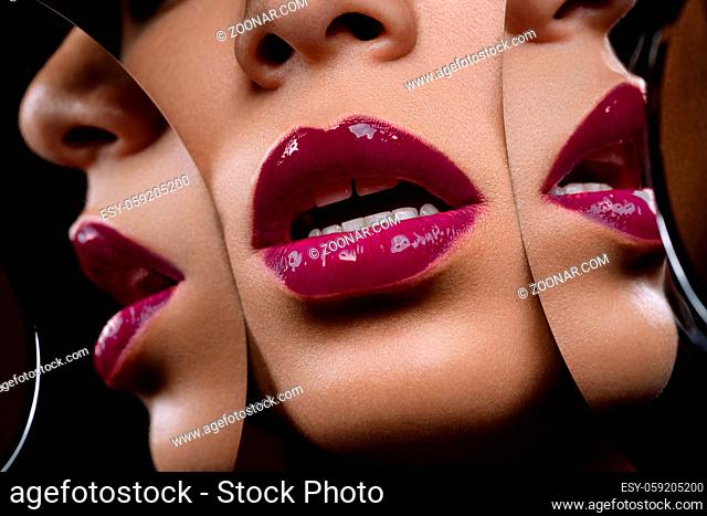 closeup shot of full sexy woman lips with purple lipstick with mirror reflections. copyspace
