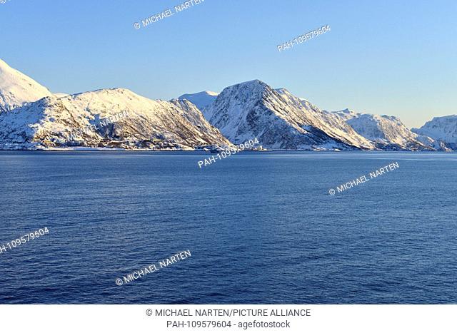 North Norway's cold snow-white rocky coast with the small village Øksfjord by the waterside, 9 March 2017 | usage worldwide