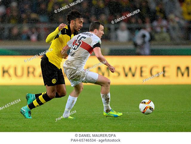 Stuttgart's Kevin Grosskreutz in action against Dortmund's Pierre-Emerick Aubameyang (L) during the DFB Cup quarterfinal soccer match between VfB Stuttgart and...