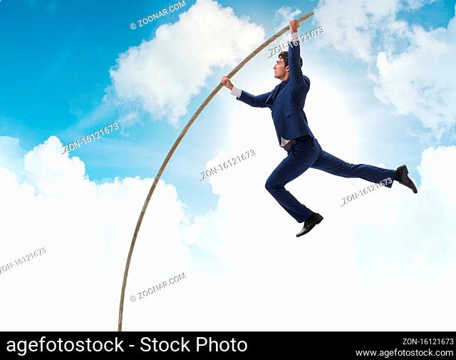The businessman in pole vaulting concept
