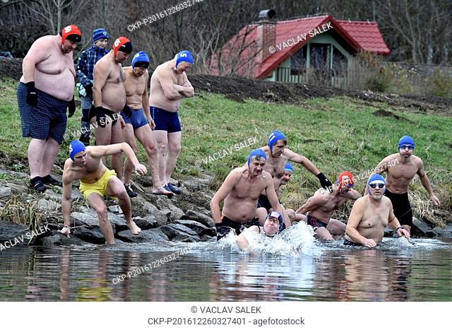 Contestants swim in the Dyje river during 42th Christmas Kilometer Race, a Christmas winter swimmers meeting, in Breclav, Czech Republic, on Monday, December 26