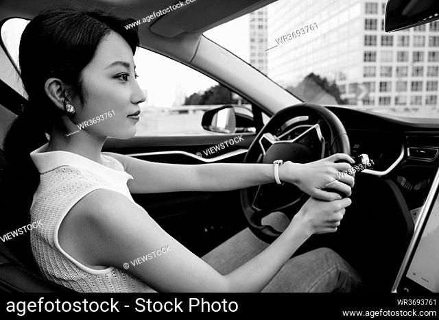 Driving turning young woman