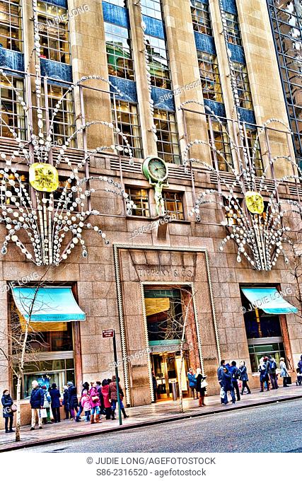 Christmas shoppers and Strollers in front of a Decorated Tiffany's 57th Street, New York City store